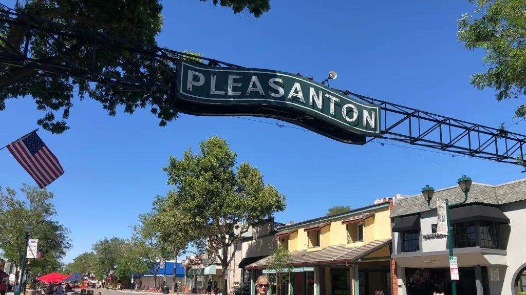 The Pleasanton sign arching over Main Street downtown