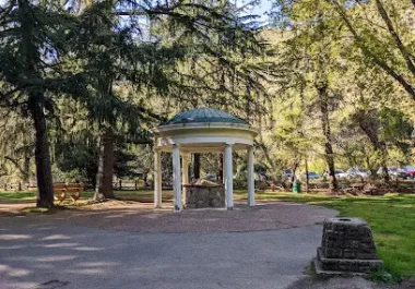 White gazebo with dome roof in tree-lined park setting, Alum Rock Park