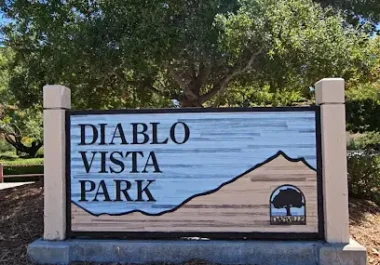 Diablo Vista Park sign in Danville, California with large oak tree