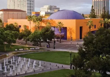 The Tech Interactive museum with purple dome and orange exterior in San Jose, California