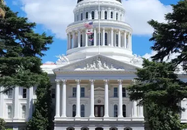 California State Capitol building in Sacramento with white columns and dome